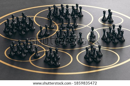 3D illustration of many pawns grouped together into golden circles over black background. Market segmentation concept. ストックフォト © 