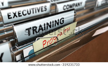 Close up on a file tab with the word training, focus on a yellow, note where it is handwritten program, blur effect. Concept image for illustration of employee, training