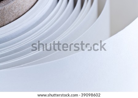 roll of a white paper background in the angle of a page