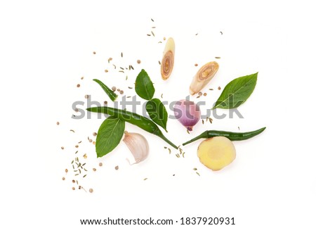 Green chili, shallot, garlic, pepper, cumin, basil, kaffir lime leaves, lemongrass and galangal isolated on a white background, top view, flat lay. Foto d'archivio © 
