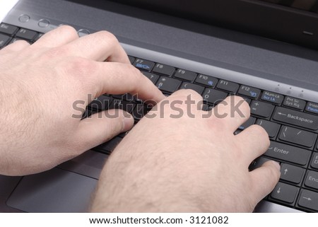 Male hands typing over black keyboard