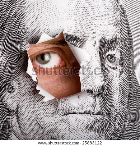 Close up of portrait of Benjamin Franklin form 100 dollars with living male eye