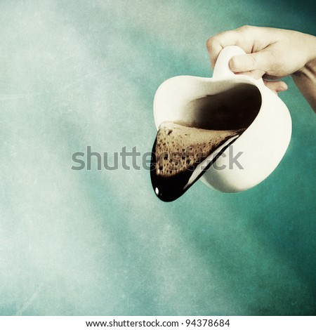Smiling cup of coffee. Textured,grained & toned./Funny Cup of Coffee