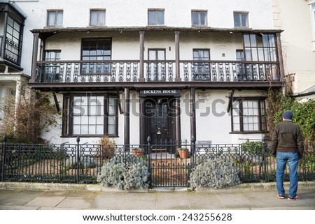 BROADSTAIRS, UK - JAN 7, 2015. A tourist stands outside the Dickens House Museum. It is housed in the cottage that was Charles Dickens inspiration for the home of Betsey Trotwood in David Copperfield.