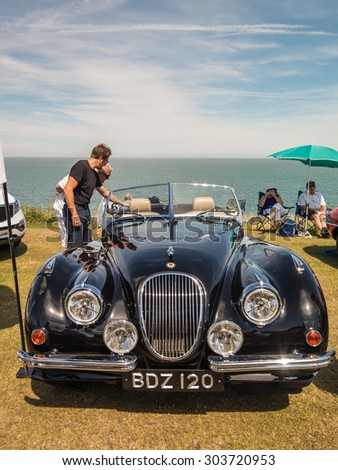Whitstable, UK, 2nd August 2015. A blue vintage Jaguar car is on display for visitors to Tankerton slopes to enjoy during the classic car motor show in Whitstable, Kent.