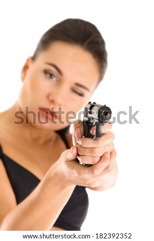 beautiful special agent with gun pointed to camera