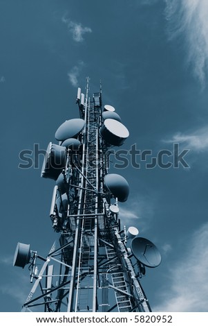 A modern communications tower in blue tone.