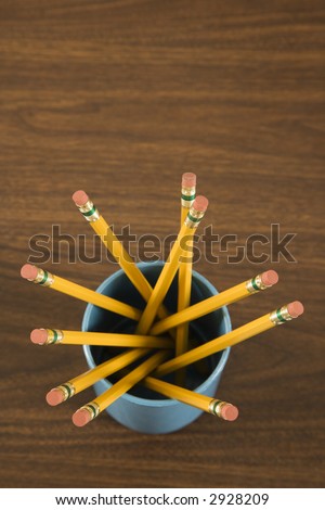 Bird\'s eye view of wooden pencils in cup.