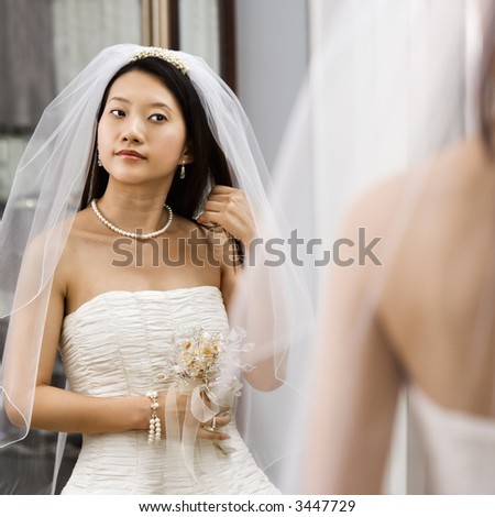 http://image.shutterstock.com/display_pic_with_logo/85699/85699,1180971116,2/stock-photo-asian-bride-looking-at-herself-in-a-mirror-3447729.jpg
