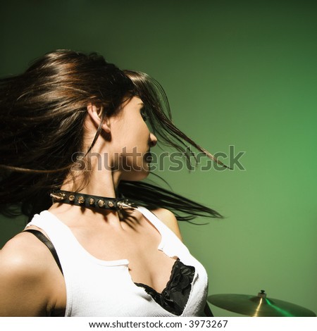 Caucasian female swinging her hair.