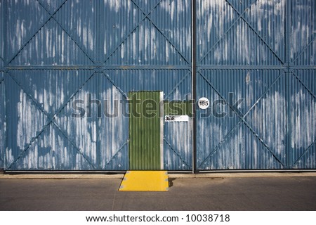 Exterior of building  with door and metal siding, Australia.