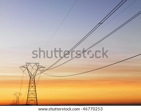 Line Of Electrical Towers And Power Lines At Sunset. Horizontal Shot ...