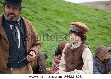 LONDON, UK - SEPTEMBER 7TH, 2014: actors playing English peasants of the old days, as part of the Greenwich Tall Ship Festival in London.