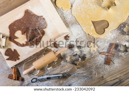 Christmas baking, all on the table: pasta, cake form, meal, providing wood, spices
