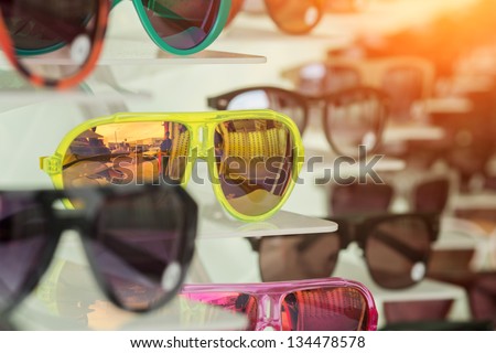 Many colorful sunglasses on display