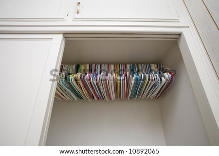Colorful hangers in empty white closet