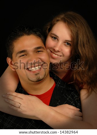 beautiful young engaged spanish caucasian ethnic mixed couple