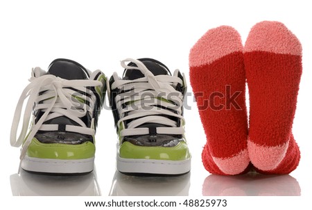 colorful socks and running shoes with reflection on white background