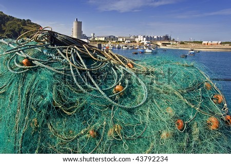 An image of fishing nets in the port by the ocean