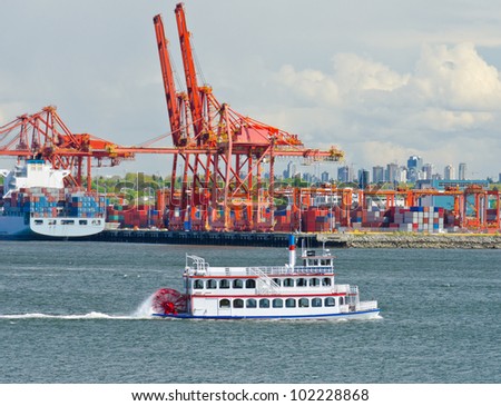 Container port terminal with historic  ( antic vessel ) boat in front of.  Vancouver,  Canada