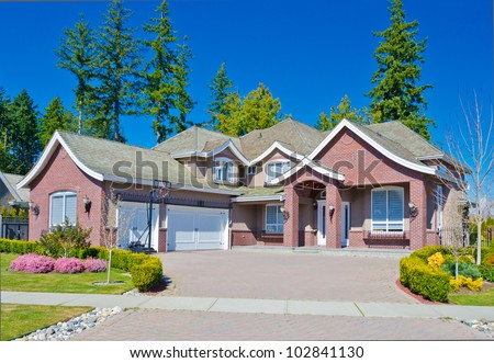 Luxury triple garage doors home in the suburbs of  Vancouver, Canada.