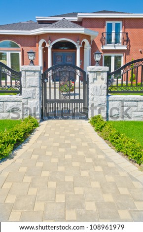 Nicely paved and designed doorway. Entrance to the house.