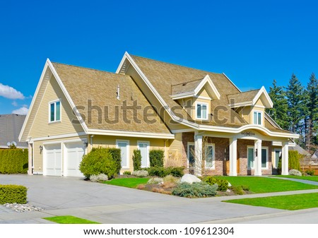 Custom built big luxury house with double doors garage in a residential neighborhood. Suburbs of Vancouver ( Surrey ) Canada.
