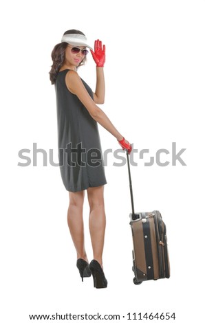 Attractive happy traveler  woman with suitcase. Isolated on white.