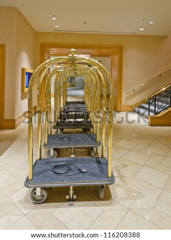 Lobby of the luxury five stars hotel with the luggage carts and the counter. Vancouver, Canada.