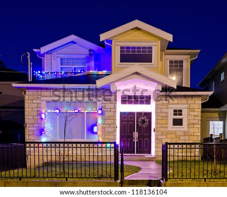 Home decorated and lighted for Christmas and for New Year Eve at Night at Vancouver, Canada.