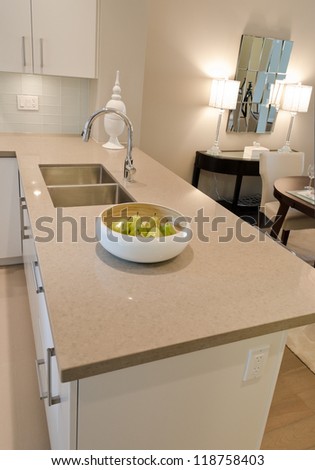 Interior design of a luxury modern kitchen with the dish with some pears