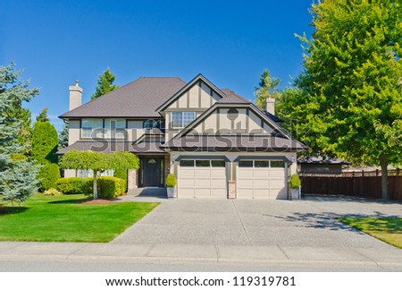 Big custom made double doors garage luxury house in the suburbs of Vancouver, Canada.