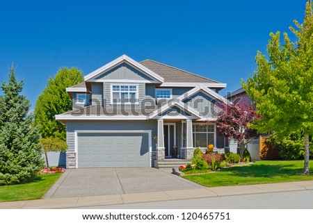 Big custom made with double doors garage luxury house in the suburbs of Vancouver, Canada.