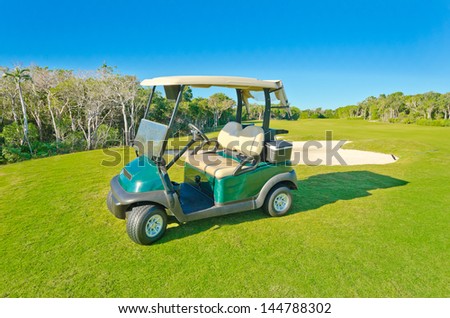 Panorama, outlook at the beautiful golf course with the golf cart . Mexican resort.