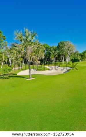 Sand bunker on the beautiful golf course. Mexican resort. Bahia Principe.  Riviera Maya. Vertical.