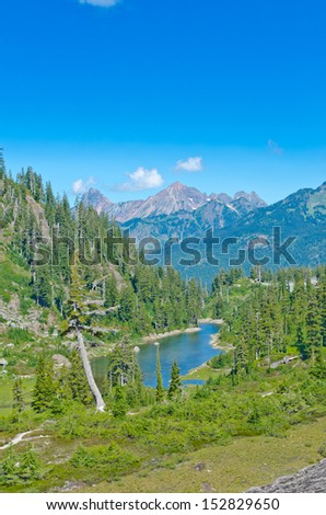 Gorgeous mountain view. Outlook at the valley at Mount Baker lands and wilderness with Bagley lake at the base. North America. Vertical.