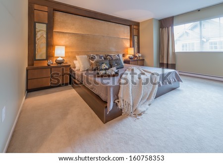 Modern comfortable, nicely decorated, elegant luxury master bedroom. Interior design.