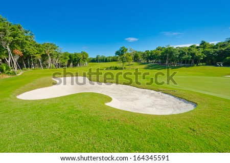 Sand bunker at the beautiful golf course. Mexican resort. Bahia Principe.  Riviera Maya.