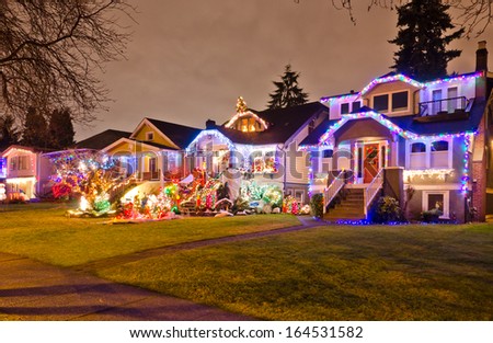 Neighborhood, houses decorated and lighted for Christmas and for New Year Eve . Night in Vancouver, Canada.