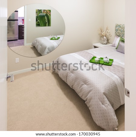 Modern comfortable and elegant luxury master bedroom with the decorative coffee tray and big mirror. Interior design.