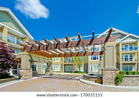 Nice and comfortable neighborhood. Modern designed entrance to the new row of townhouses  or condominiums in the suburbs of Vancouver. Canada.