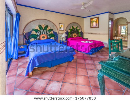 Colorful bedroom in traditional colonial style of luxury caribbean, mexican, latino hotel. Interior design.