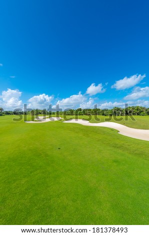 Sand bunkers at the luxury golf course. Mexican resort. Bahia Principe, Riviera Maya. Vertical.