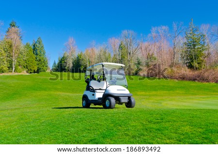 Golf cart at the beautiful golf course.