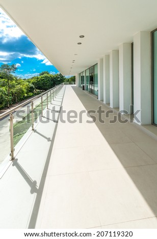 Perspective of the modern glass and steel balcony, deck, patio, promenade railing. Exterior, interior design. Vertical.