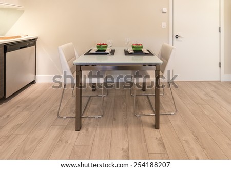 Nicely decorated and served living, lunch, dining room table. Interior design.