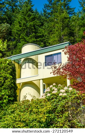 Big custom made luxury modern house with nicely landscaped front yard in the suburb of Vancouver, Canada. Vertical.