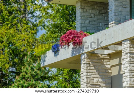 Fragment of the concrete architectural structure of the modern custom build luxury house.