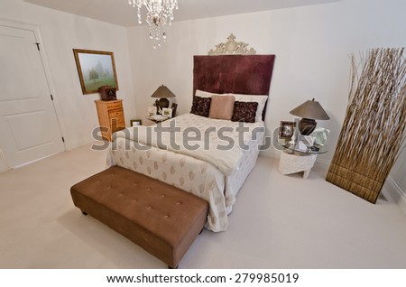 Nicely decorated luxury bedroom day time. Interior design.