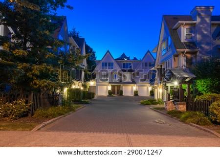Townhouses, homes, community at  dusk, night time in suburbs of Vancouver, Canada.